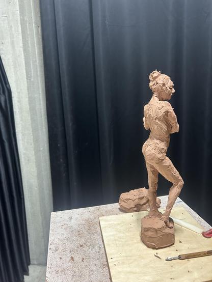 A plasticine clay 12” sculpture of Brittany in a standing pose. It’s about 20 hours of work.